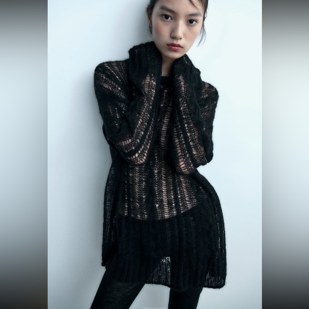 Open work cable knit sweater